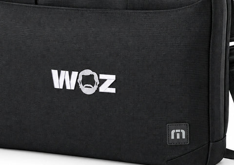 WOZ x TravisMathew Lateral Briefcase - front artwork and lower bag, cropped from the existing catalog image.