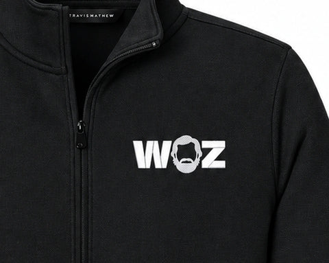WOZ × TravisMathew Women's Quarter-Zip - chest artwork and quarter zip, cropped from the existing catalog image.