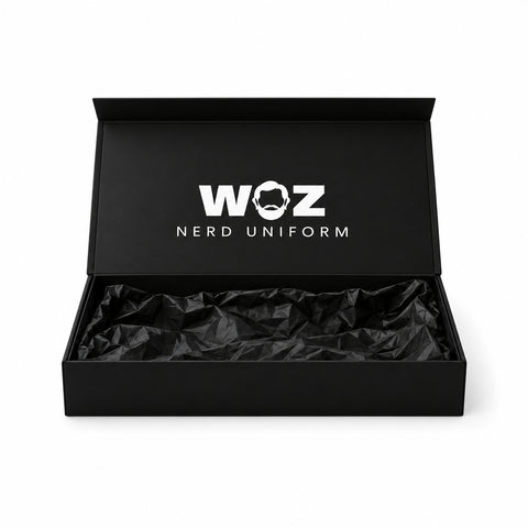 WOZ Nerd Uniform branded black presentation box with open logo lid and black tissue, product render on white.