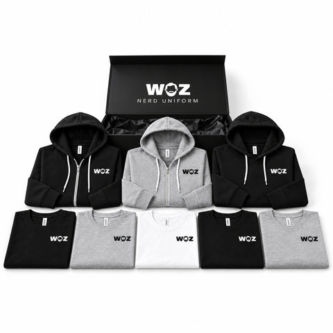 WOZ Nerd Uniform Box with five black, gray and white tees, two zip-up hoodies, one black pullover hoodie and branded black presentation box.